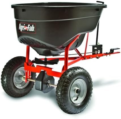 Alt Text for image 1: Agri-Fab Pull Behind Broadcast Spreader in a field